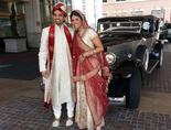 South Asian wedding couple with special Vintage Limo